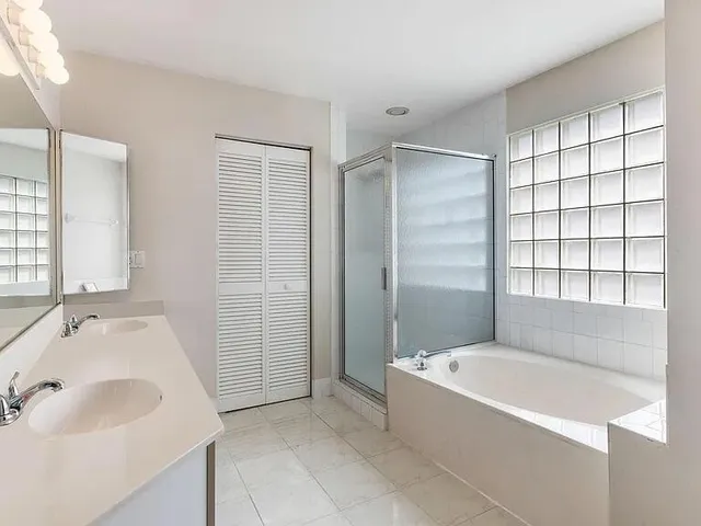 a bathroom with a bathtub and a sink