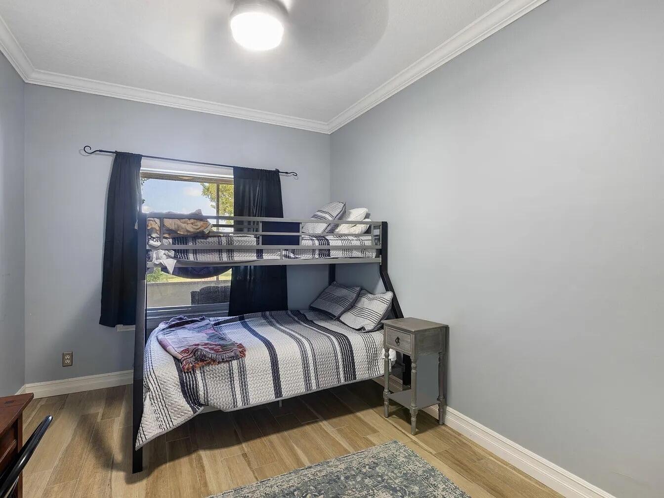 7782 Hoffy Circle Lake Worth, FL 33467 - Photo 20 of 27 a bedroom with a bed and large window