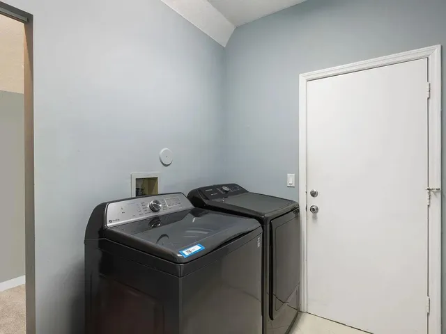 a utility room with washer and dryer