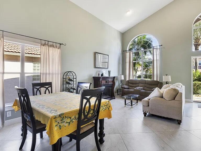 7782 Hoffy Circle Lake Worth, FL 33467 - Photo 5 of 27 a view of a dining room with furniture and a large window