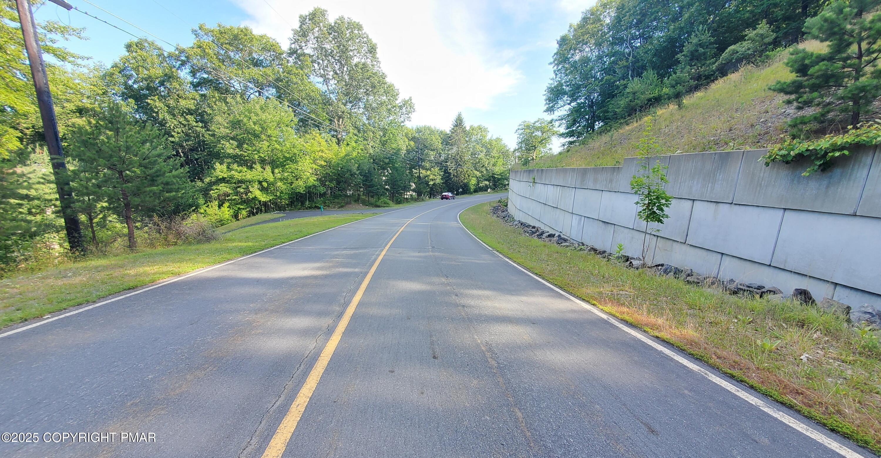 3428 Lancaster Drive Bushkill, PA 18324 - Photo 4 of 5 a view of a backyard with large trees