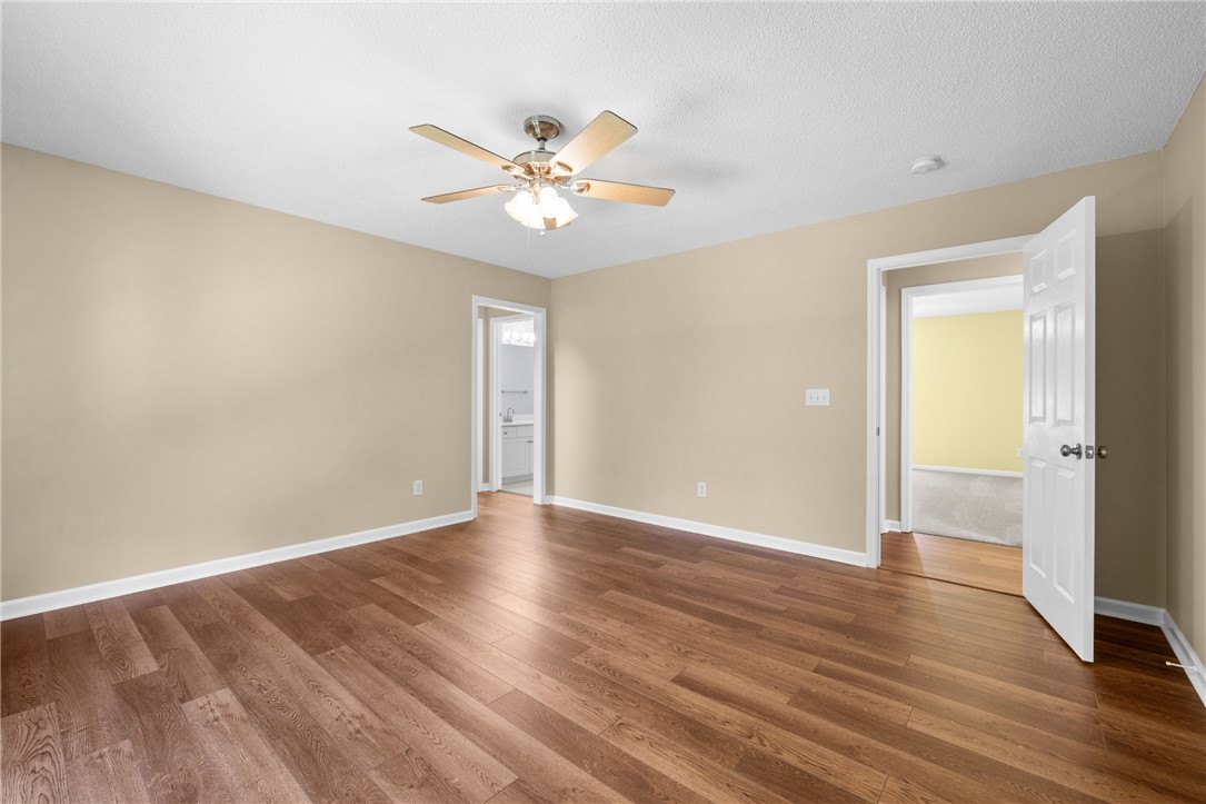 429 Burns Mill Road West Union, SC 29696 - Photo 20 of 49 Wood flooring and neutral tones define this versatile living space, perfect for quiet contemplation.