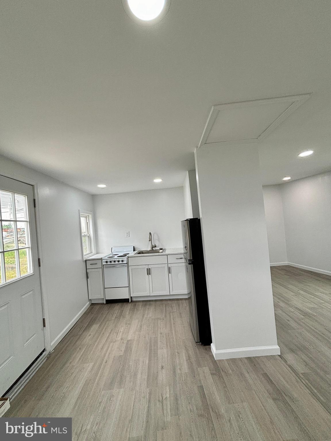218 Elm Street Steelton, PA 17113 - Photo 19 of 22 a view of a kitchen with wooden floor and electronic appliances