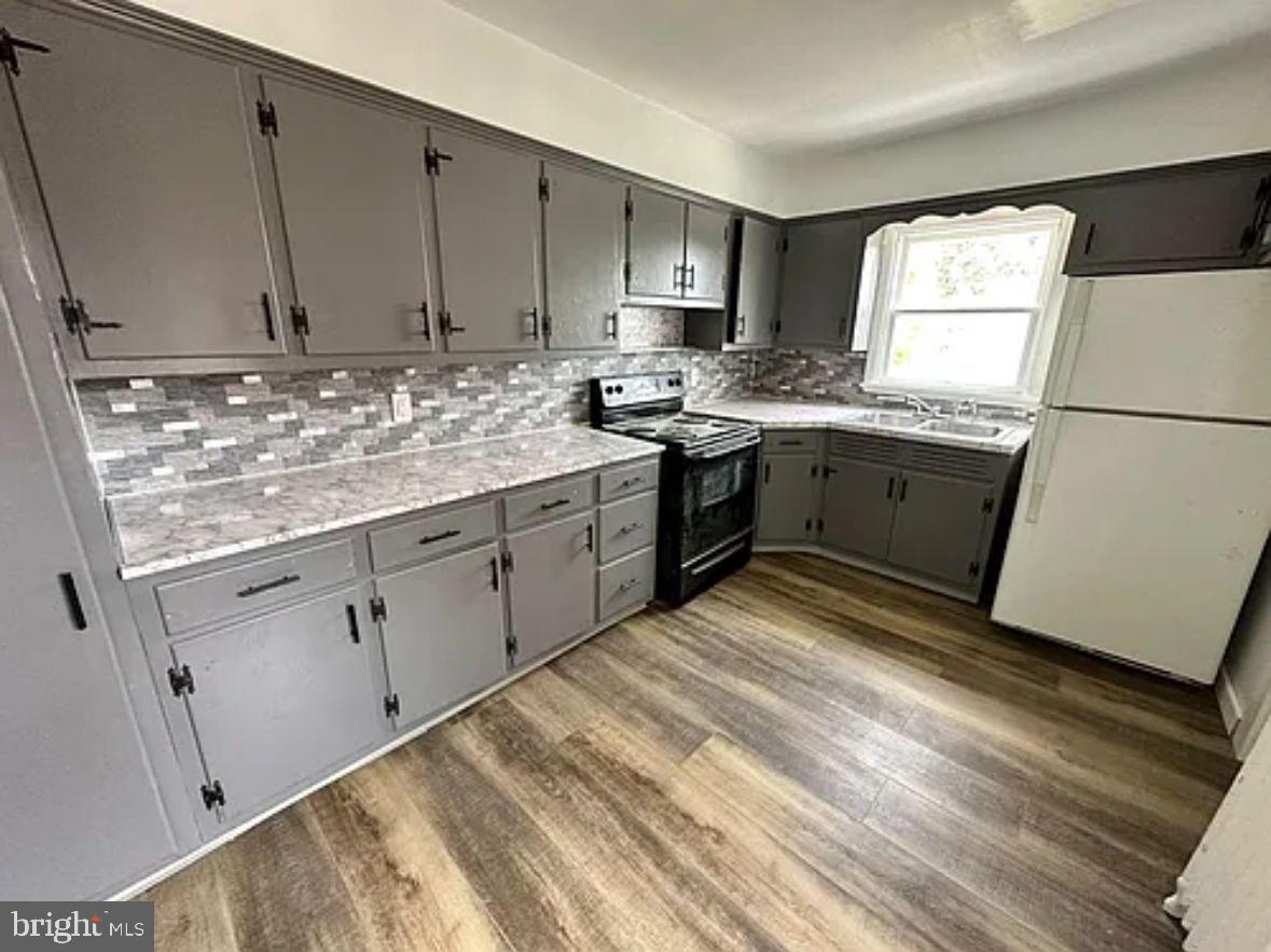 218 Elm Street Steelton, PA 17113 - Photo 7 of 22 a kitchen with granite countertop cabinets stainless steel appliances a sink and a window