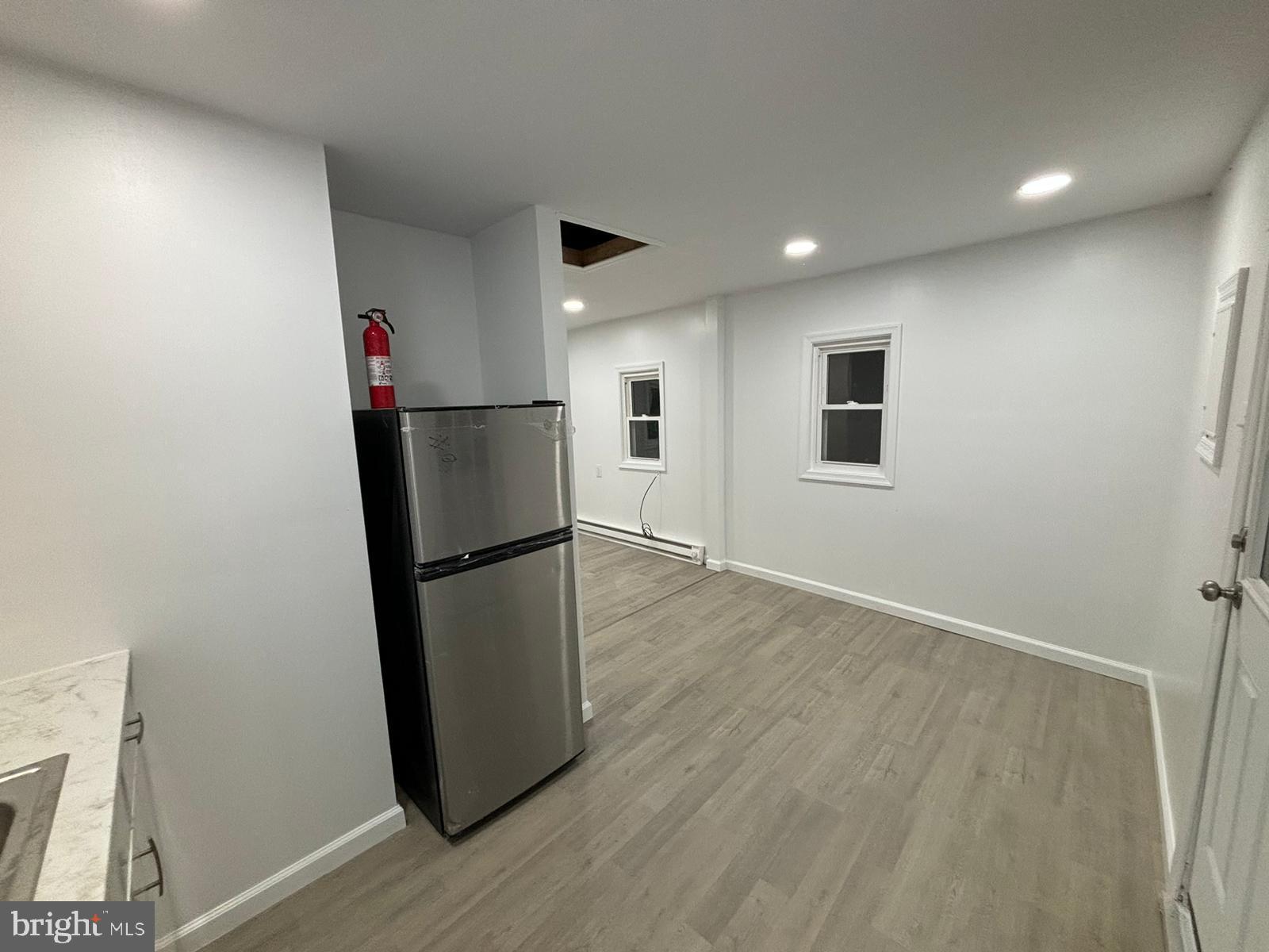 218 Elm Street Steelton, PA 17113 - Photo 10 of 22 a view of a kitchen with a refrigerator and a table