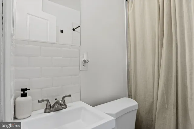 a bathroom with a sink and toilet