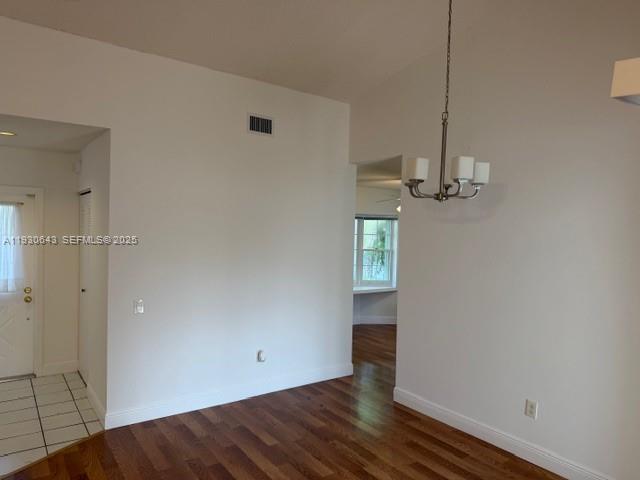 14624 Southwest 143rd Pl Circle Miami, FL 33186 - Photo 13 of 13 a view of empty room with wooden floor and window