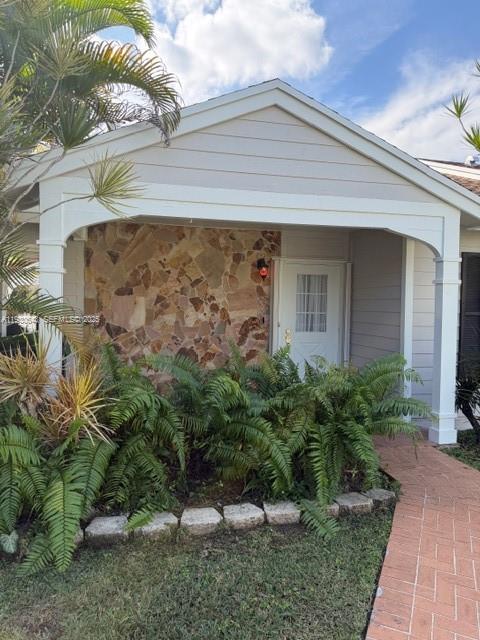 14624 Southwest 143rd Pl Circle Miami, FL 33186 - Photo 3 of 13 a view of a house with a yard