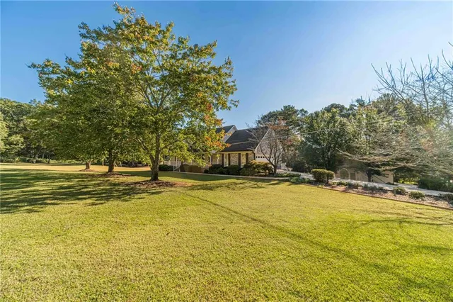 a view of a swimming pool with an outdoor space and seating area