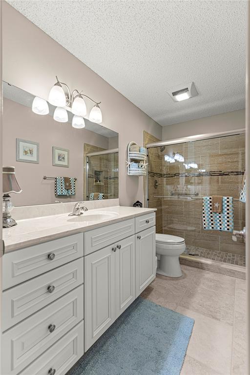 8431 Southwest 93rd Place, Unit G Ocala, FL 34481 - Photo 17 of 50 a bathroom with a double vanity sink and a mirror