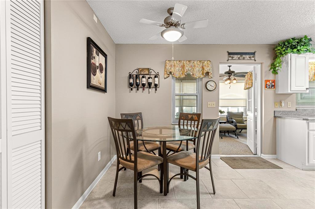 8431 Southwest 93rd Place, Unit G Ocala, FL 34481 - Photo 24 of 50 a view of a dining room that has a table and chairs