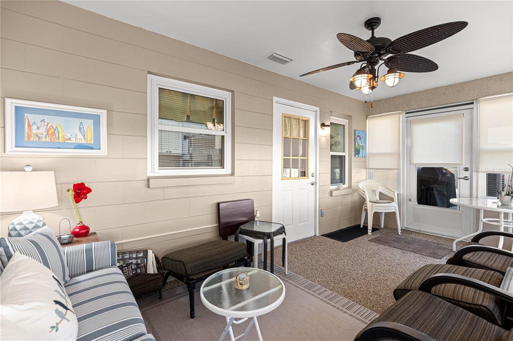 8431 Southwest 93rd Place, Unit G Ocala, FL 34481 - Photo 29 of 50 a living room with furniture and a large window