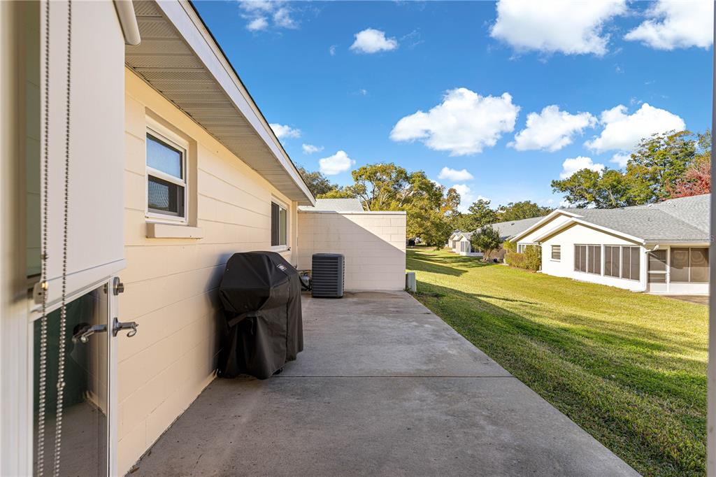 8431 Southwest 93rd Place, Unit G Ocala, FL 34481 - Photo 31 of 50 a front view of a house with garden