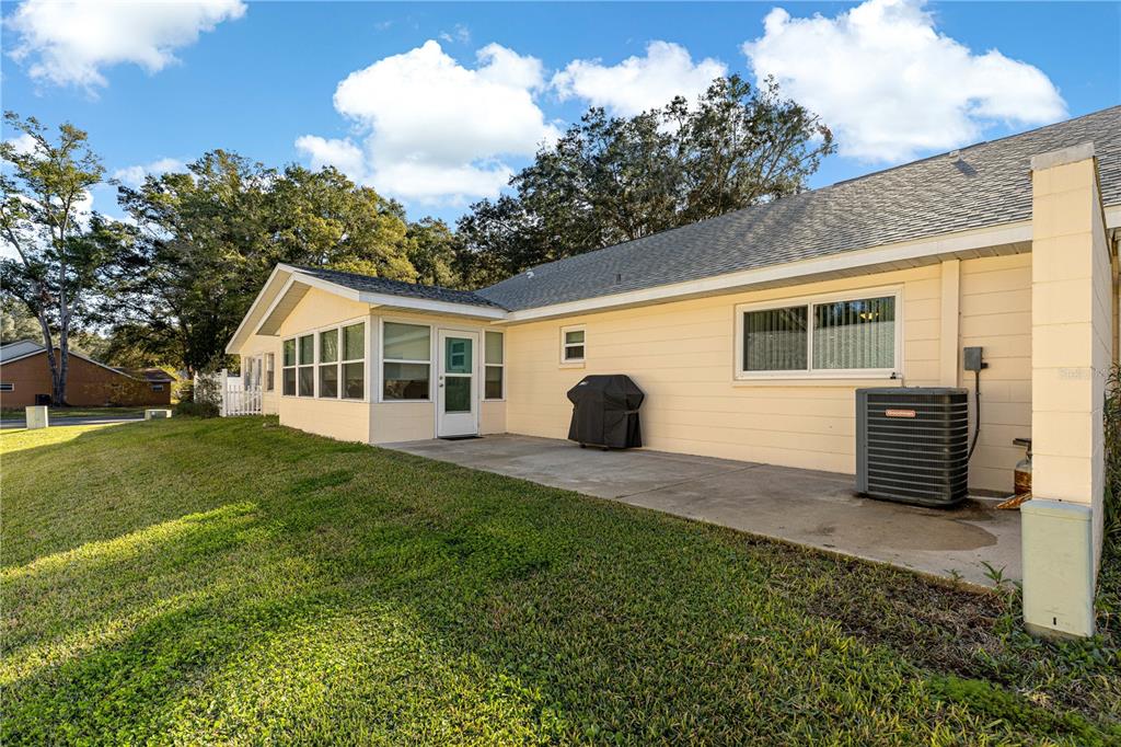 8431 Southwest 93rd Place, Unit G Ocala, FL 34481 - Photo 34 of 50 a view of a house with a yard