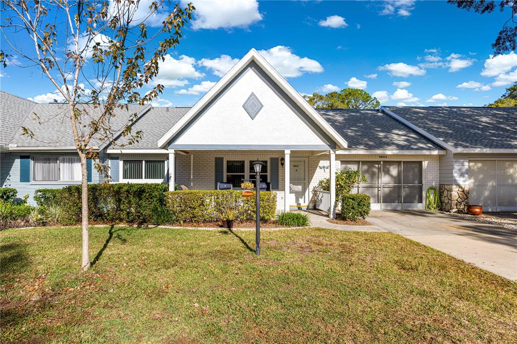 8431 Southwest 93rd Place, Unit G Ocala, FL 34481 - Photo 4 of 50 a house view with a sitting space and garden space