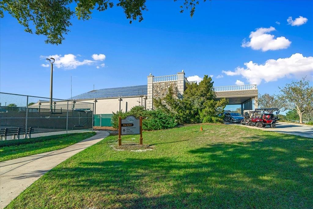 8431 Southwest 93rd Place, Unit G Ocala, FL 34481 - Photo 50 of 50 a view of a house with a backyard and a fire pit