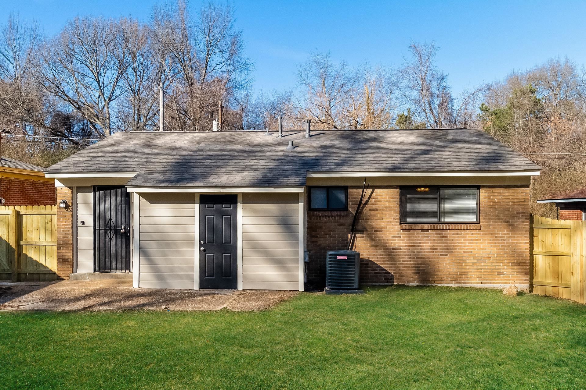 453 Charter Avenue Memphis, TN 38109 - Photo 14 of 16 a view of a house with a yard