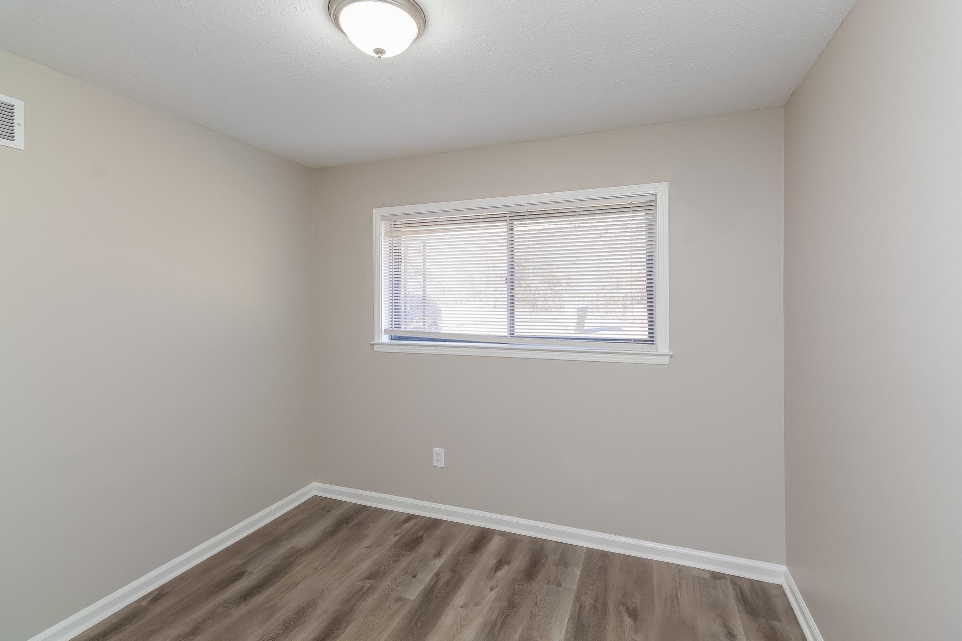 453 Charter Avenue Memphis, TN 38109 - Photo 10 of 16 an empty room with a window