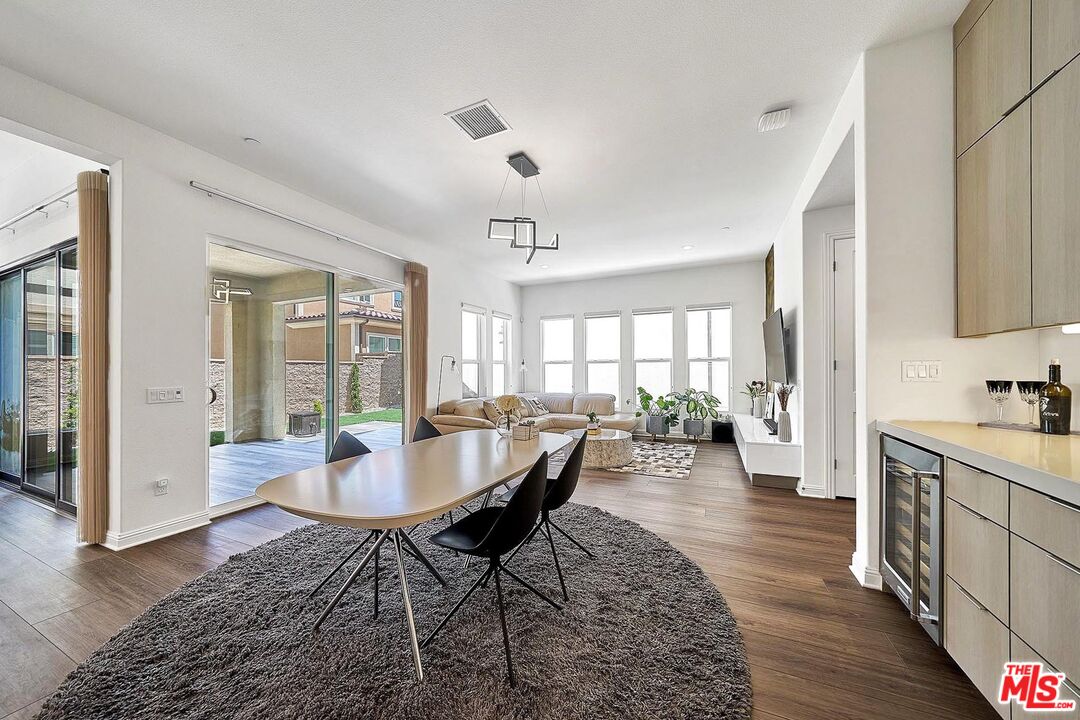 20641 Walnut Circle Porter Ranch, CA 91326 - Photo 13 of 47 a view of a dining room with furniture window and wooden floor