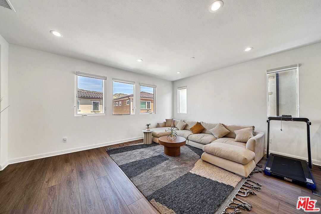 20641 Walnut Circle Porter Ranch, CA 91326 - Photo 21 of 47 a living room with furniture and wooden floor