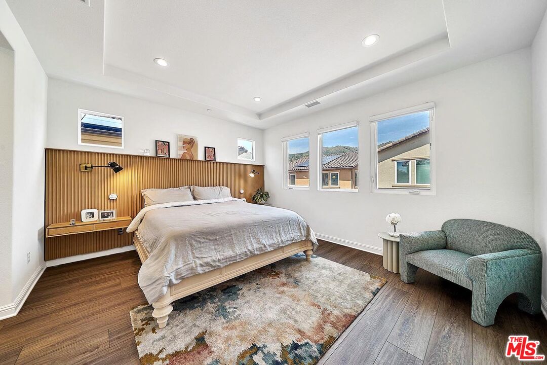 20641 Walnut Circle Porter Ranch, CA 91326 - Photo 25 of 47 a bedroom with a bed couch and a window