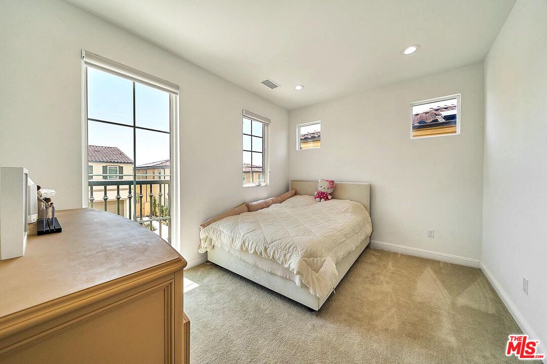 20641 Walnut Circle Porter Ranch, CA 91326 - Photo 32 of 47 a bedroom with two beds and a large window