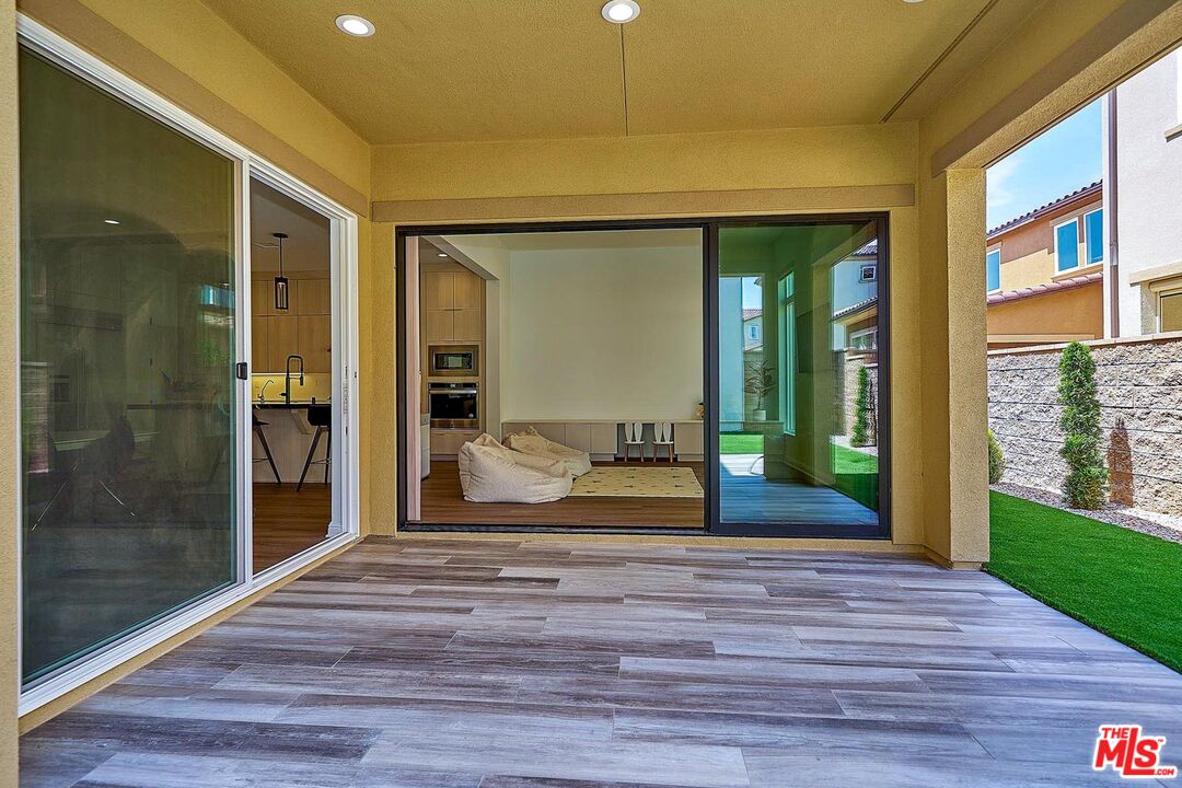 20641 Walnut Circle Porter Ranch, CA 91326 - Photo 35 of 47 a bedroom with a bed and a large window