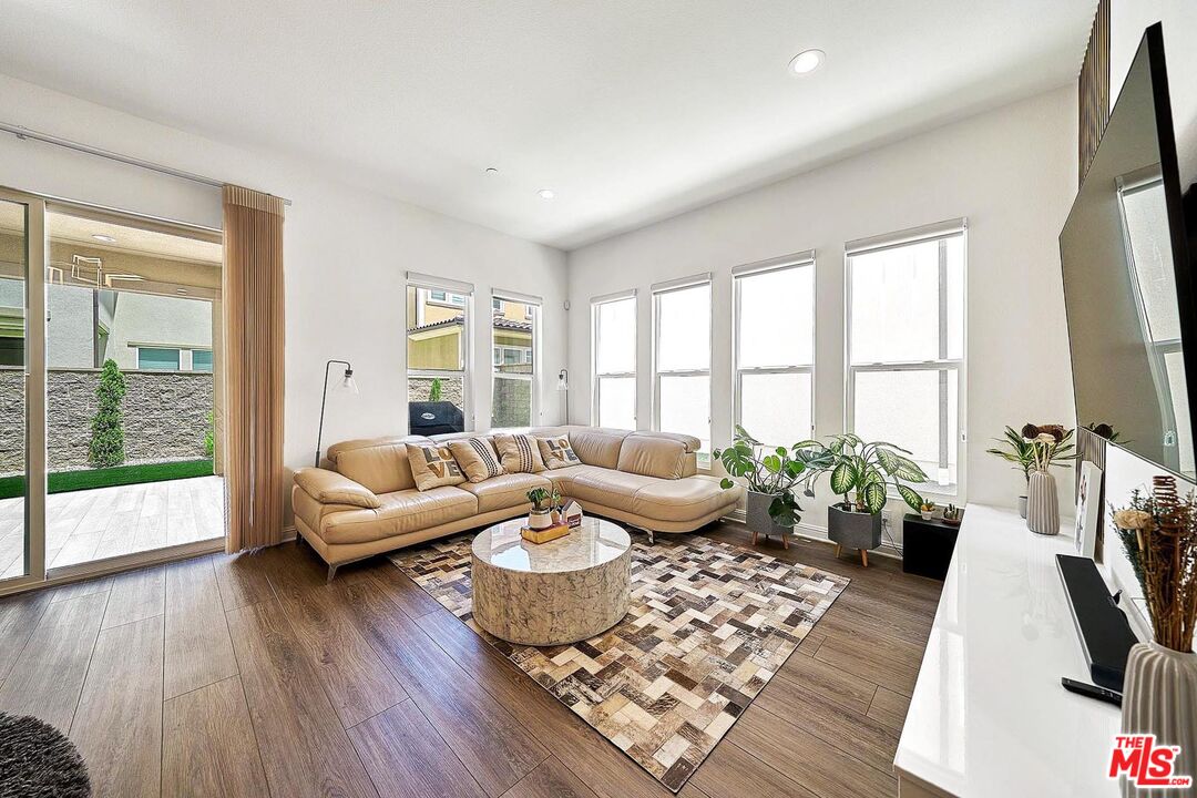 20641 Walnut Circle Porter Ranch, CA 91326 - Photo 6 of 47 a living room with furniture and a large window