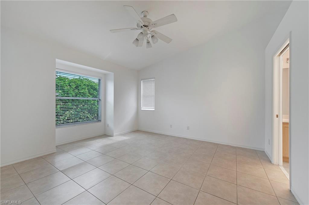 7001 Lone Oak Boulevard Naples, FL 34109 - Photo 11 of 25 a view of an empty room with a window
