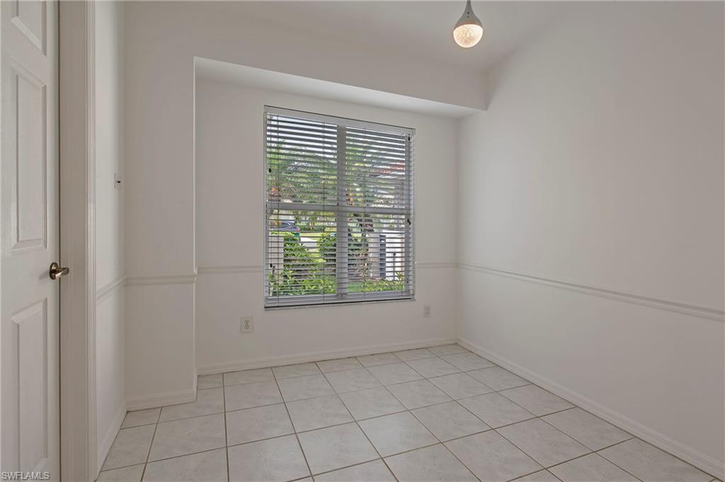 7001 Lone Oak Boulevard Naples, FL 34109 - Photo 17 of 25 a view of an empty room with a window