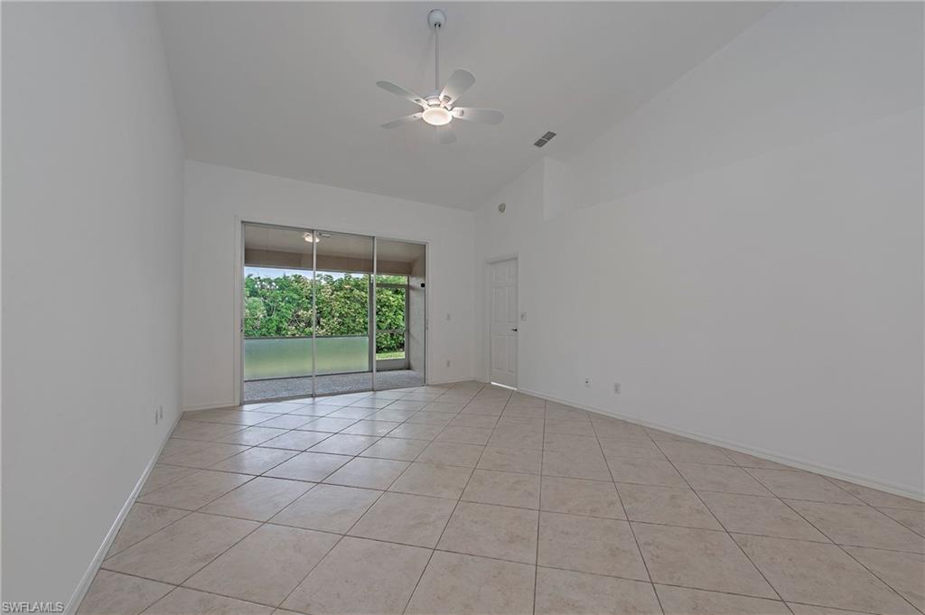 7001 Lone Oak Boulevard Naples, FL 34109 - Photo 19 of 25 a view of a livingroom with a ceiling fan and window