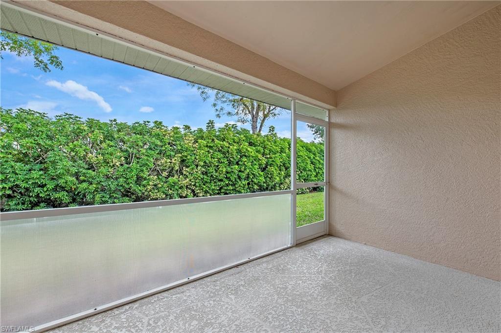 7001 Lone Oak Boulevard Naples, FL 34109 - Photo 22 of 25 a view of a garden from a window