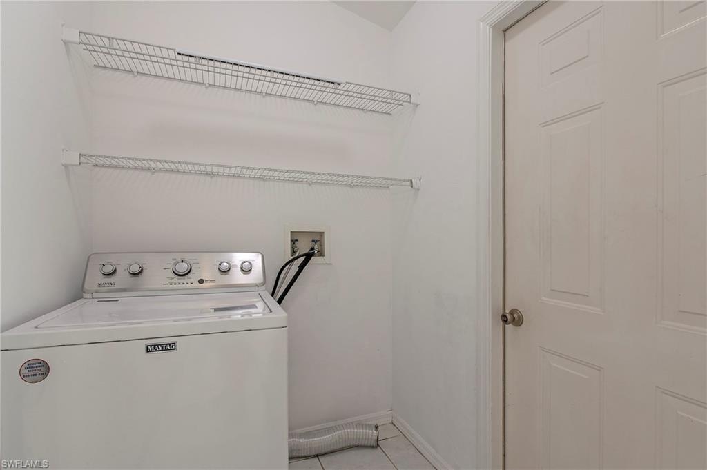 7001 Lone Oak Boulevard Naples, FL 34109 - Photo 23 of 25 a utility room with dryer and washer