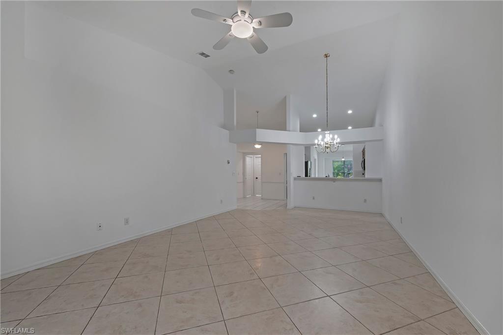 7001 Lone Oak Boulevard Naples, FL 34109 - Photo 4 of 25 a view of a room with a ceiling fan and window