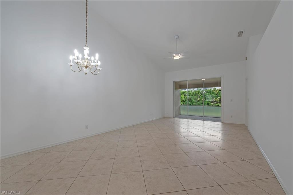 7001 Lone Oak Boulevard Naples, FL 34109 - Photo 6 of 25 a view of an empty room with a window