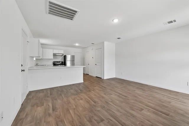 a kitchen with appliances cabinets and a sink