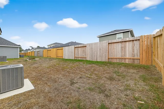 an aerial view of a house with a swimming pool
