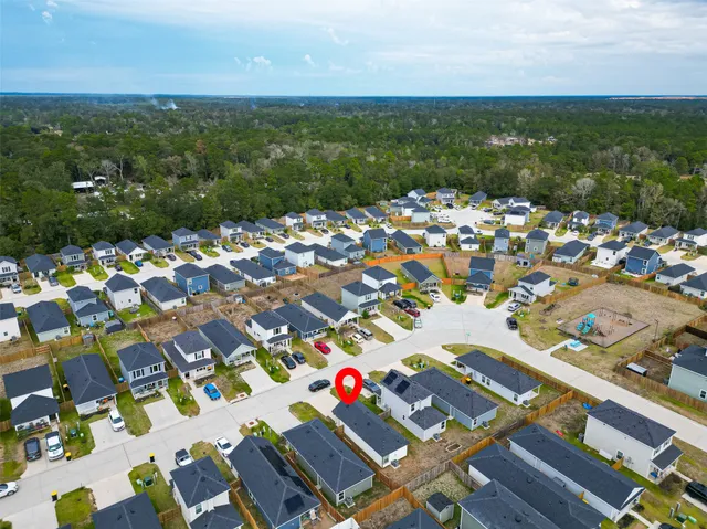 an aerial view of residential house with outdoor space