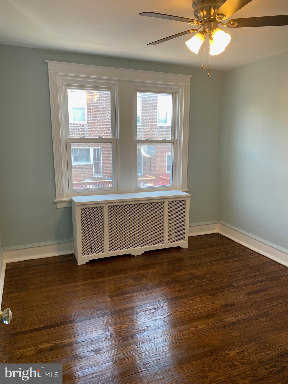 267 Sanford Road Upper Darby, PA 19082 - Photo 18 of 31 a view of an empty room with wooden floor and a window