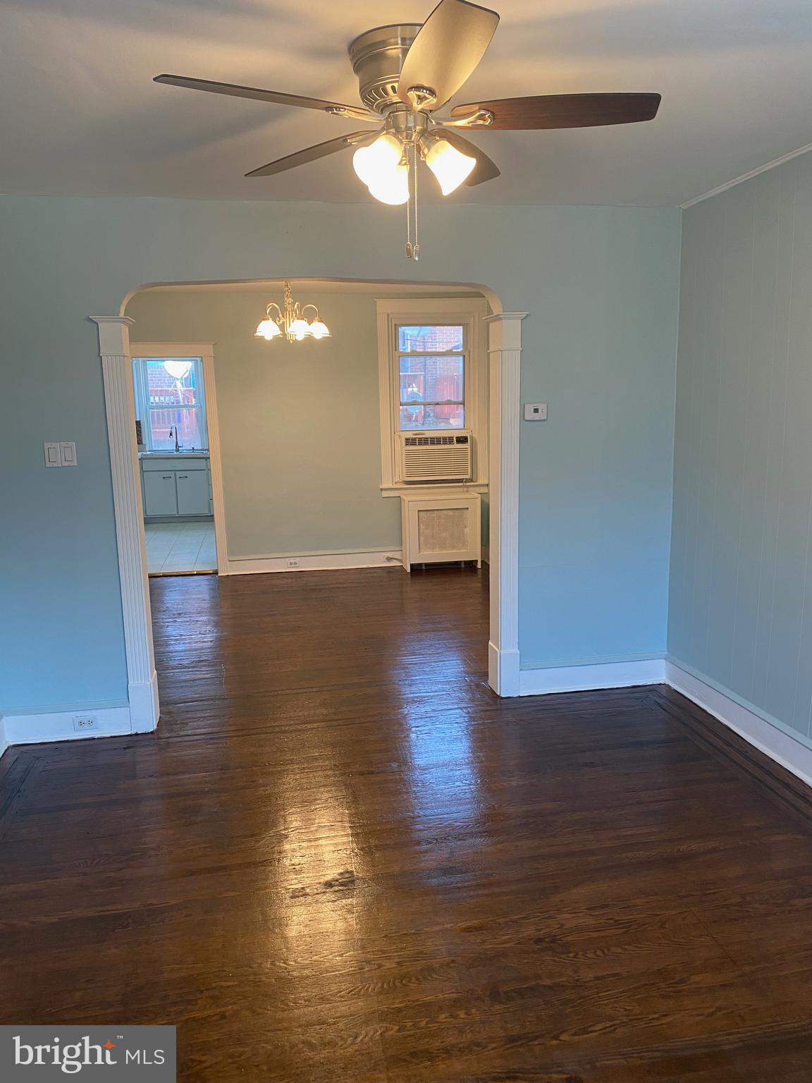 267 Sanford Road Upper Darby, PA 19082 - Photo 5 of 31 a view of a room with wooden floor and a ceiling fan