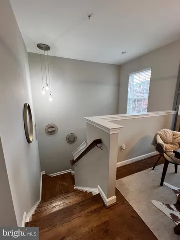 a room with gym equipment and a rug