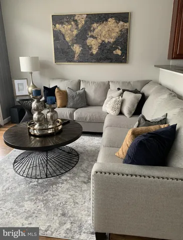 a living room with furniture and a rug