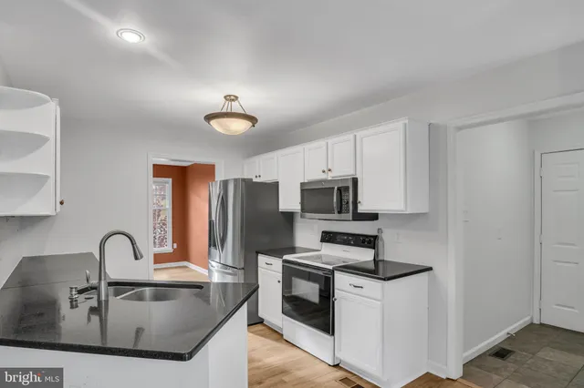 a bedroom with a bed and a tv