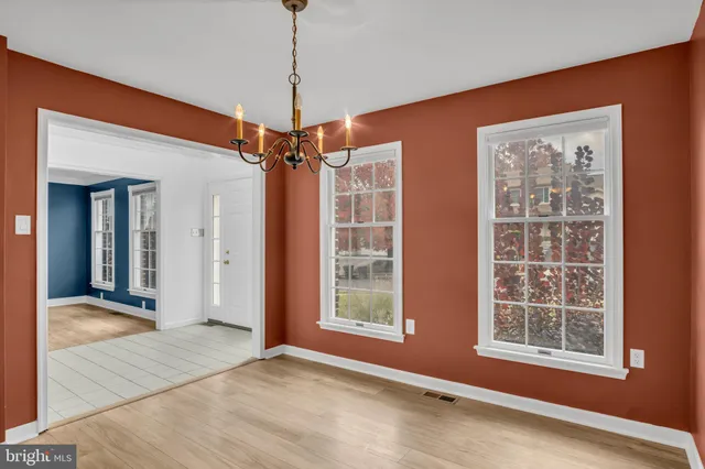 a kitchen with granite countertop a sink and cabinets