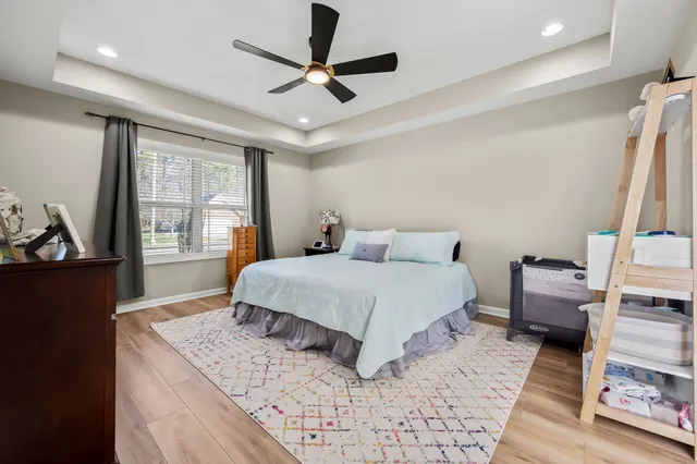 a bedroom with a large bed and a window