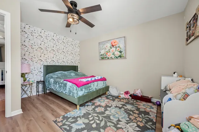 a bedroom with a bed and a fireplace