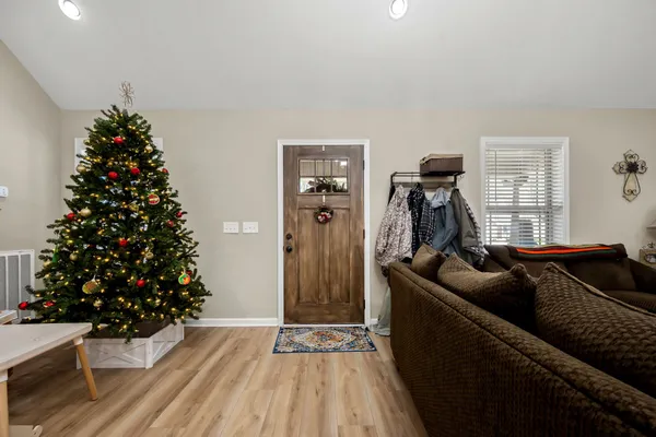 a living room with furniture and a potted plant