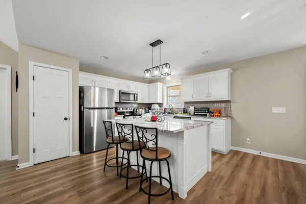 a view of a kitchen and dining room