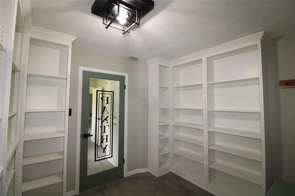 818 East Clinton Avenue Athens, TX 75751 - Photo 11 of 24 a view of walk in closet with empty racks