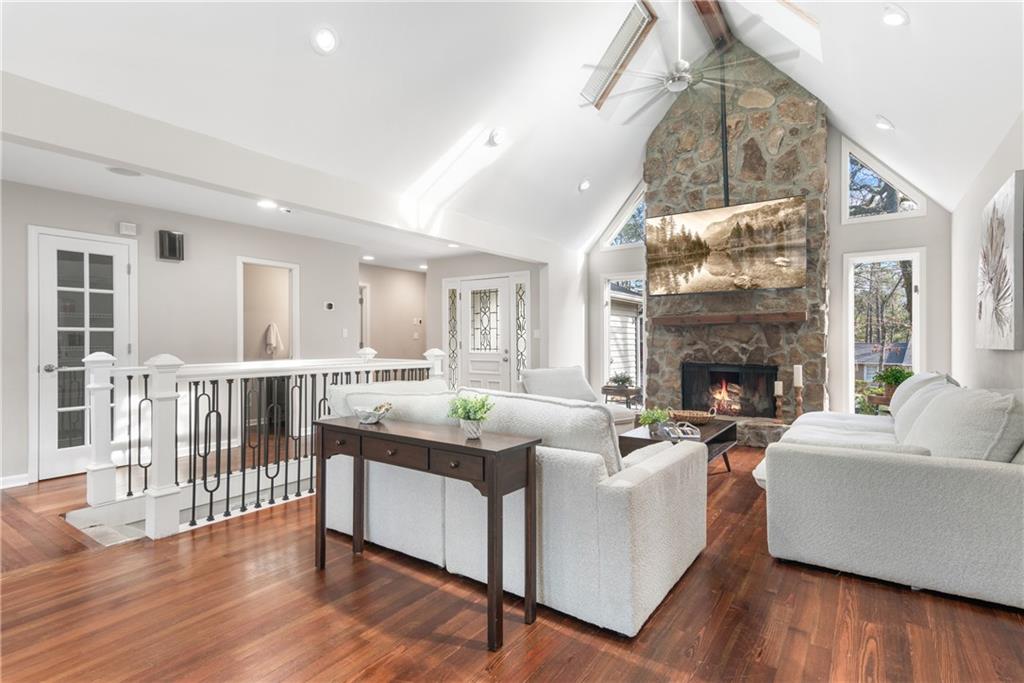 413 Sassafras Road Roswell, GA 30076 - Photo 13 of 67 a living room with furniture a fireplace and a wooden floor
